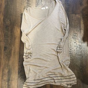 Tan tunic with black stitching